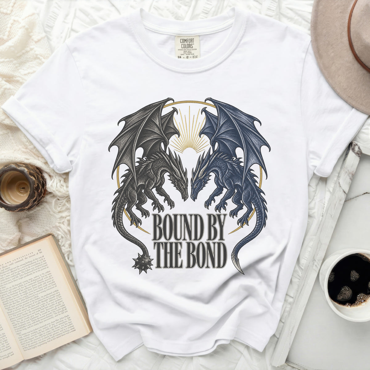 White t-shirt with "Bound by the Bond" text and two dragons.