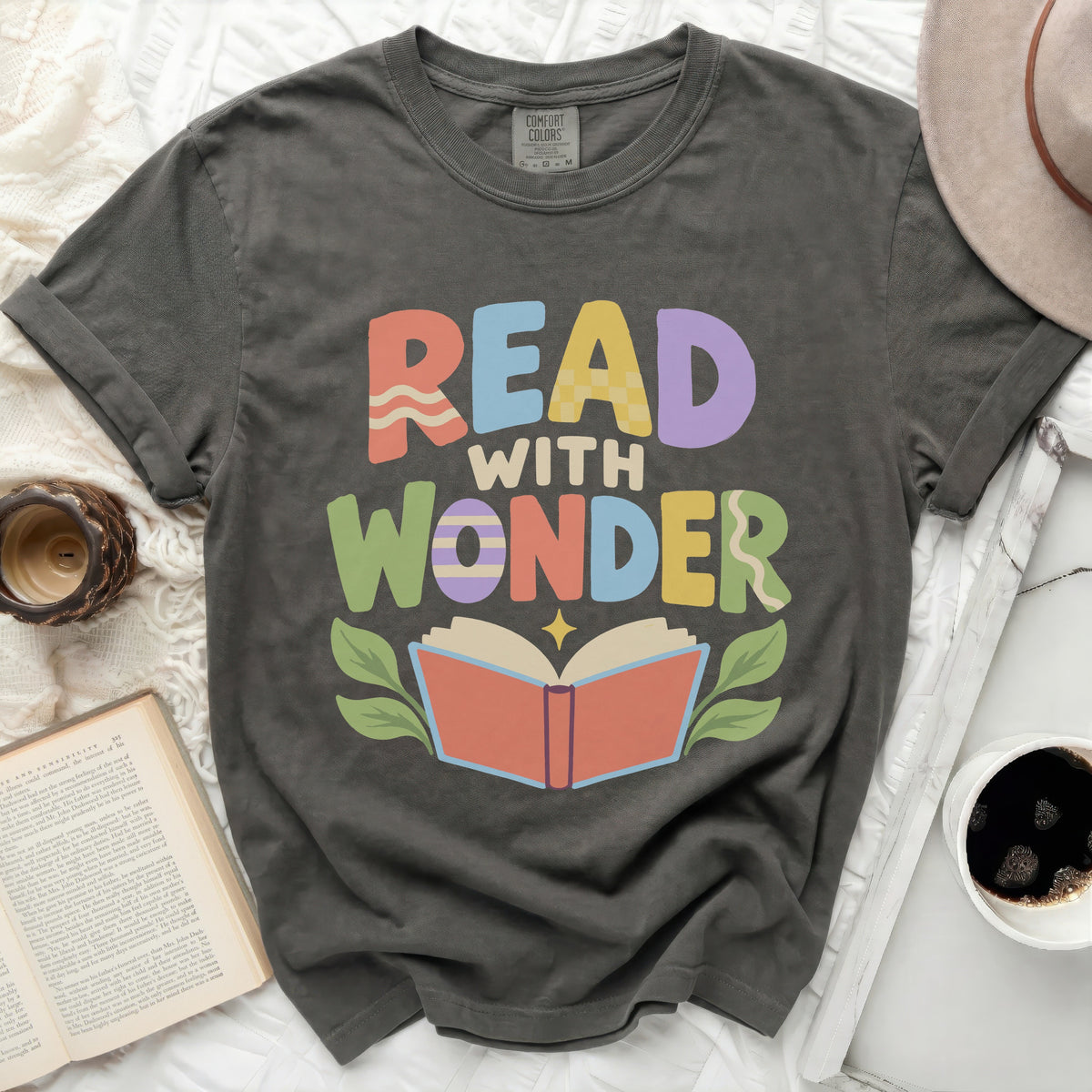 Dark grey t-shirt with "READ WITH WONDER" and an open book graphic.