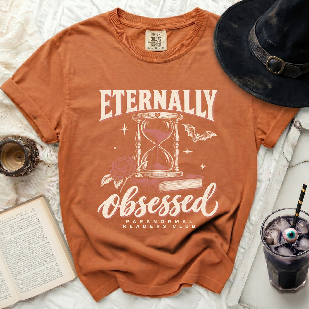 Orange t-shirt with "Eternally Obsessed Paranormal Readers Club" graphic.