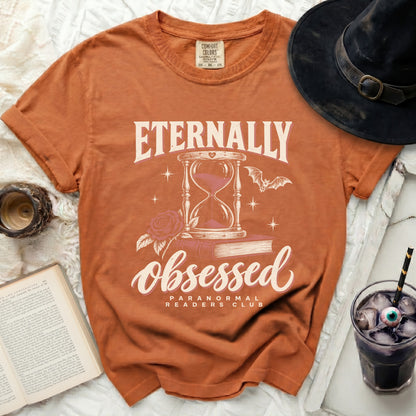 Orange t-shirt with "Eternally Obsessed Paranormal Readers Club" graphic.