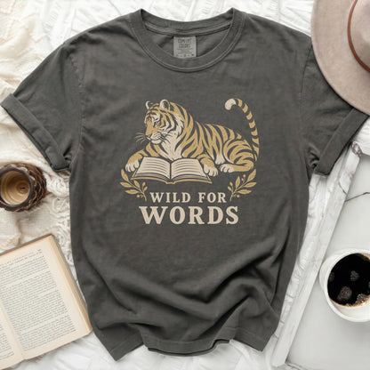 Tiger lying on an open book with the text "WILD FOR WORDS".