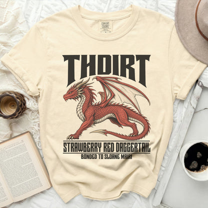Cream t-shirt with a red dragon graphic and text "THDIRT STRAWBERRY RED DAGGERTAIL BONDED TO SLOANE MAIRI".