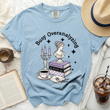 Light blue t-shirt with "Busy Overanalyzing" graphic.