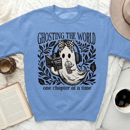 Ghosting the World one chapter at a time graphic on blue sweatshirt.