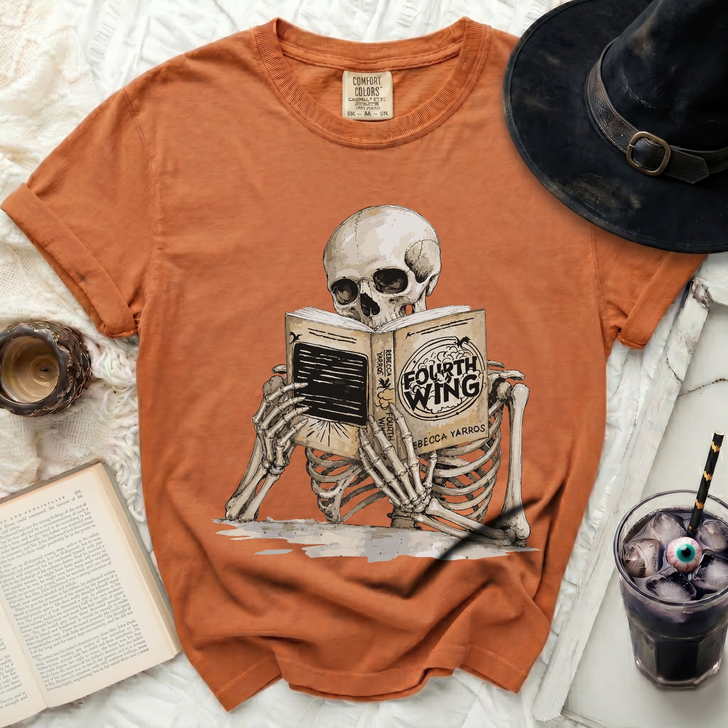 Orange t-shirt with a skeleton reading "Fourth Wing" by Rebecca Yarros.
