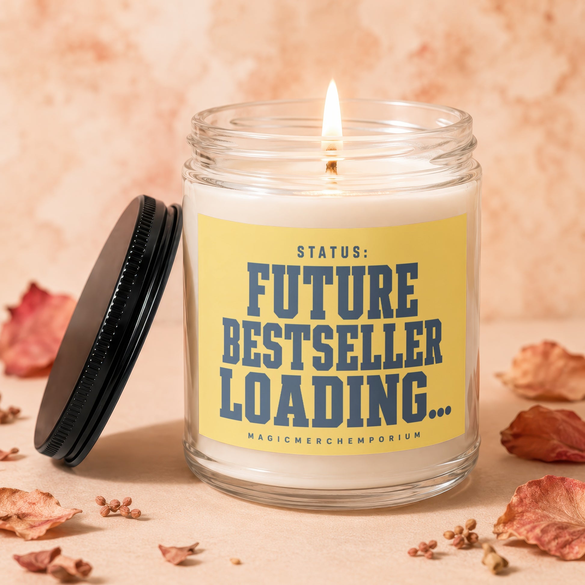 Burning candle in glass jar with yellow label reading "STATUS: FUTURE BESTSELLER LOADING...".