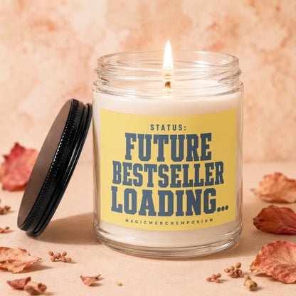 Burning candle in glass jar with yellow label reading "STATUS: FUTURE BESTSELLER LOADING...".