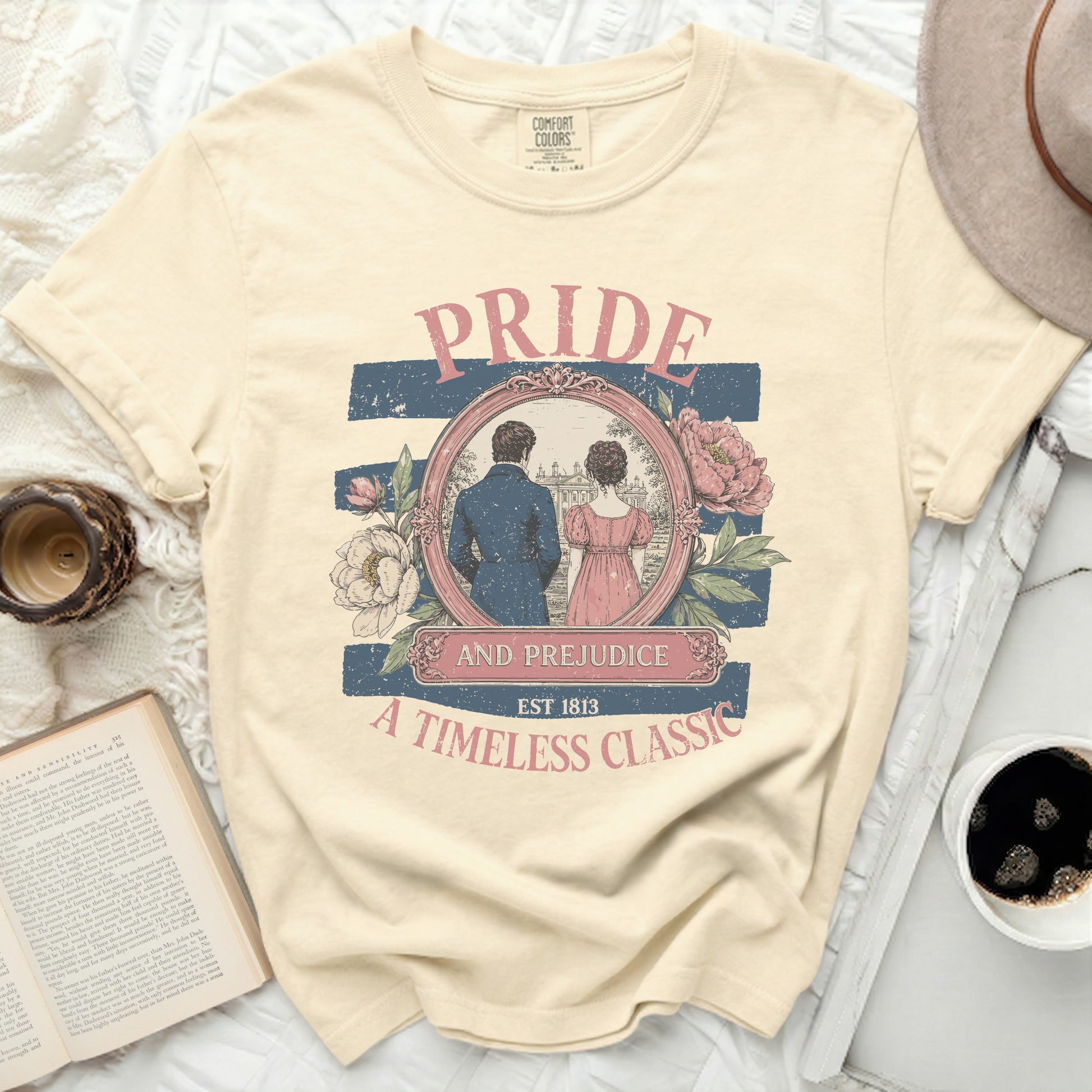 This Comfort Colors t-shirt features a "Pride and Prejudice" graphic est. 1813.