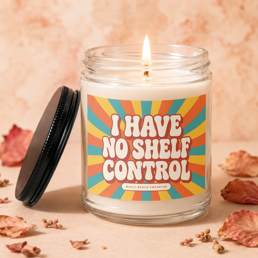 Lit candle in glass jar with "I HAVE NO SHELF CONTROL" text.