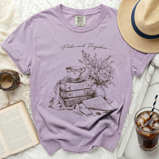 Purple t-shirt with "Pride and Prejudice" and literary sketch.