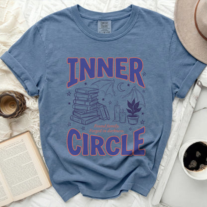 Blue t-shirt with "INNER CIRCLE" text and spooky illustrations.