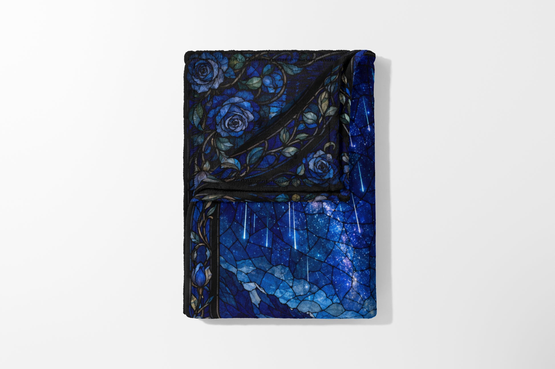 Fleece blanket with blue roses and starry sky stained glass design.