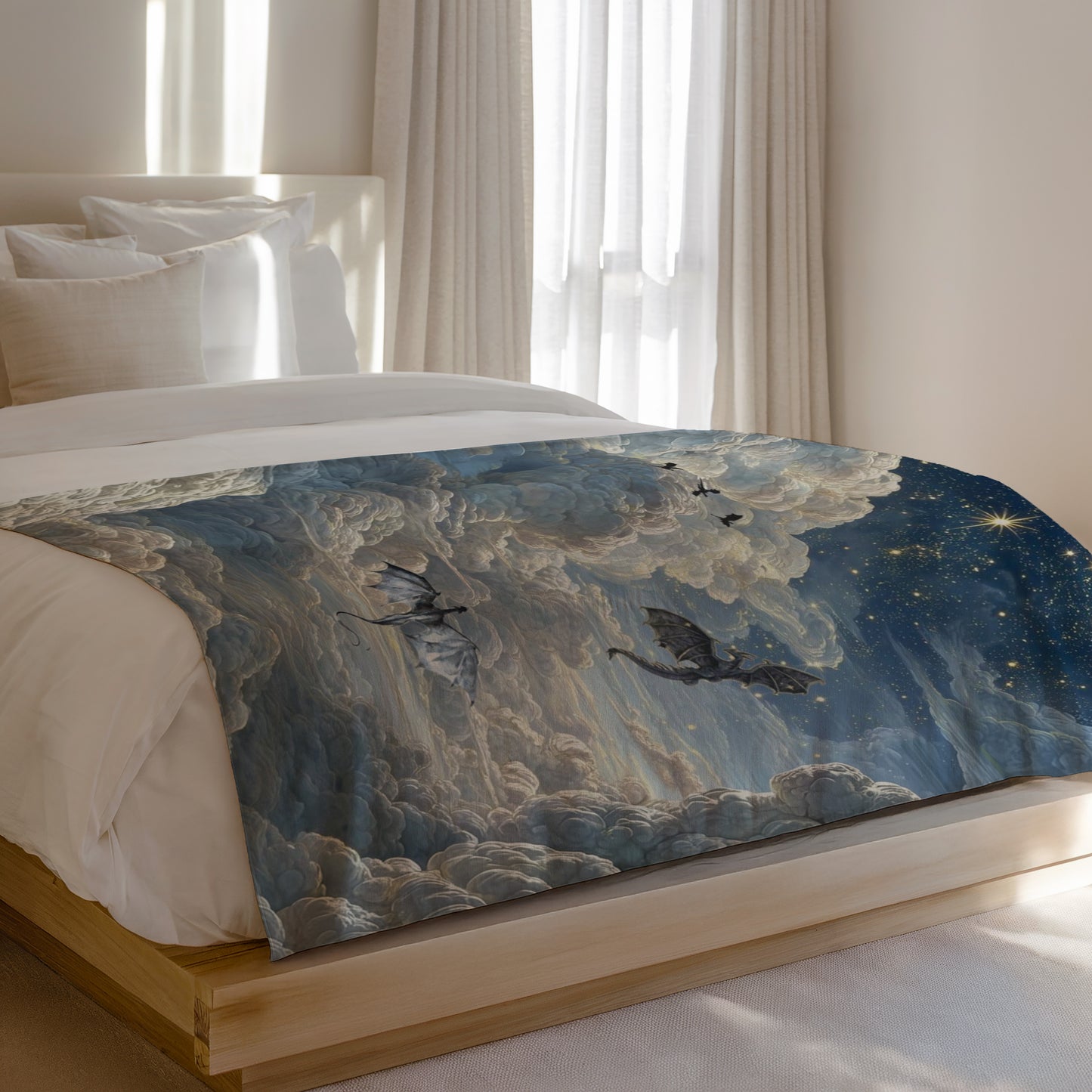 Dragons fly through a cloudy, starry night sky on a blanket on a bed.