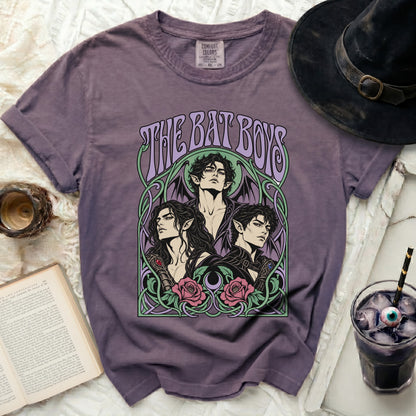 Purple t-shirt with "THE BAT BOYS" and an illustration of three men with bat wings.