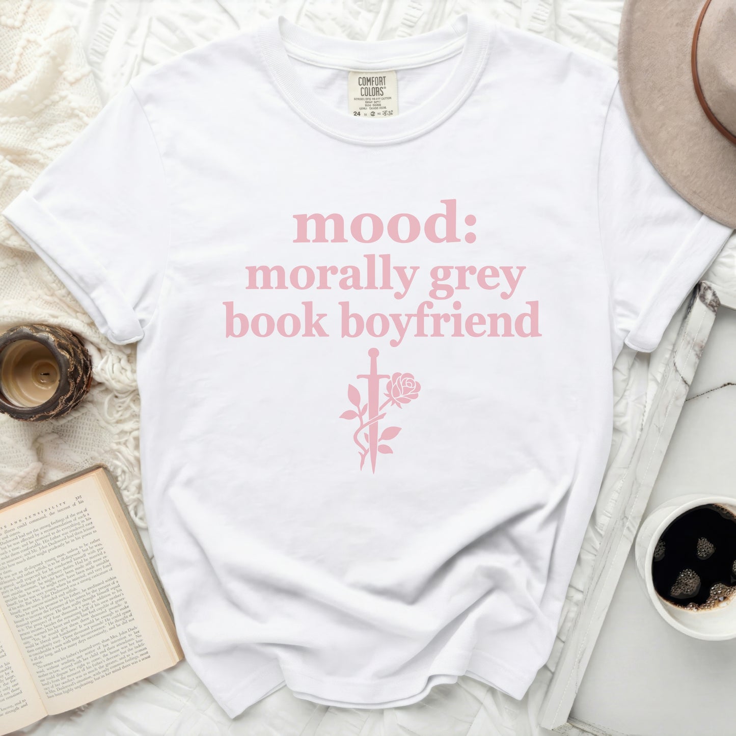 White t-shirt with pink text "mood: morally grey book boyfriend" and rose graphic.