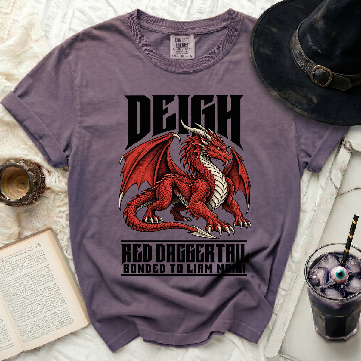 Purple t-shirt with a red dragon graphic and text "DEIGH", "RED DAGGERTAIL", and "BONDED TO LIAM MAIRI".