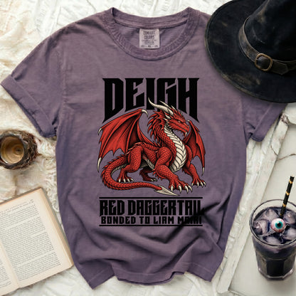 Purple t-shirt with a red dragon graphic and text "DEIGH", "RED DAGGERTAIL", and "BONDED TO LIAM MAIRI".