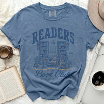 Blue t-shirt with "Readers Book Club" text and bookshelf illustration.