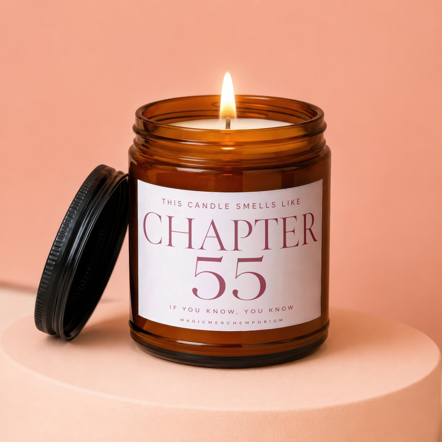 Candle labeled "CHAPTER 55 IF YOU KNOW, YOU KNOW" with lit wick