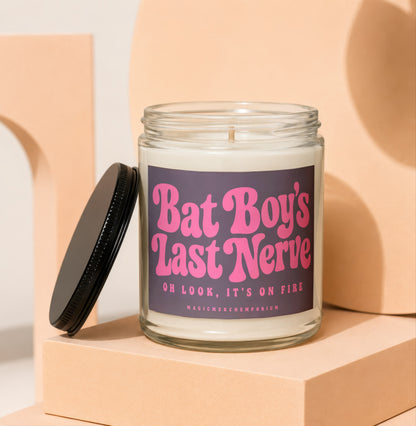 Candle with purple label reading "Bat Boy's Last Nerve Oh Look, It's On Fire".
