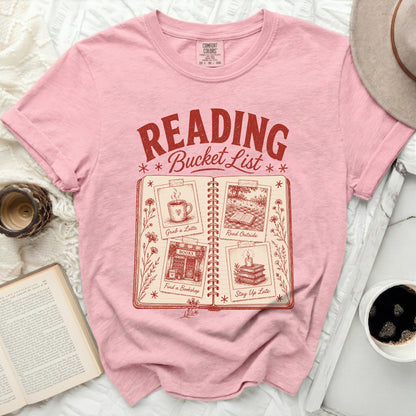 Pink t-shirt with "Reading Bucket List" graphic and four book-related activities.