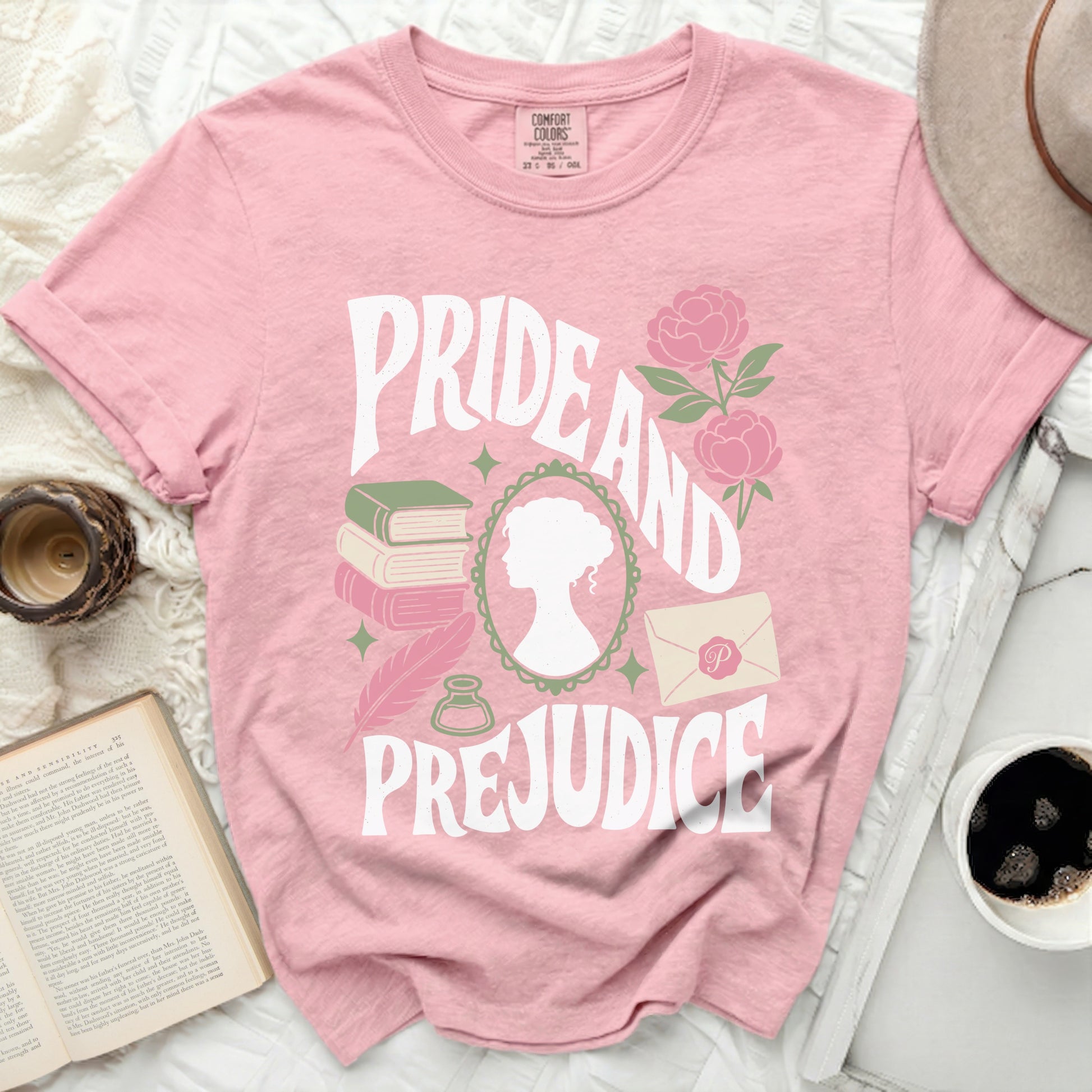 Pink t-shirt with "Pride and Prejudice" text design.