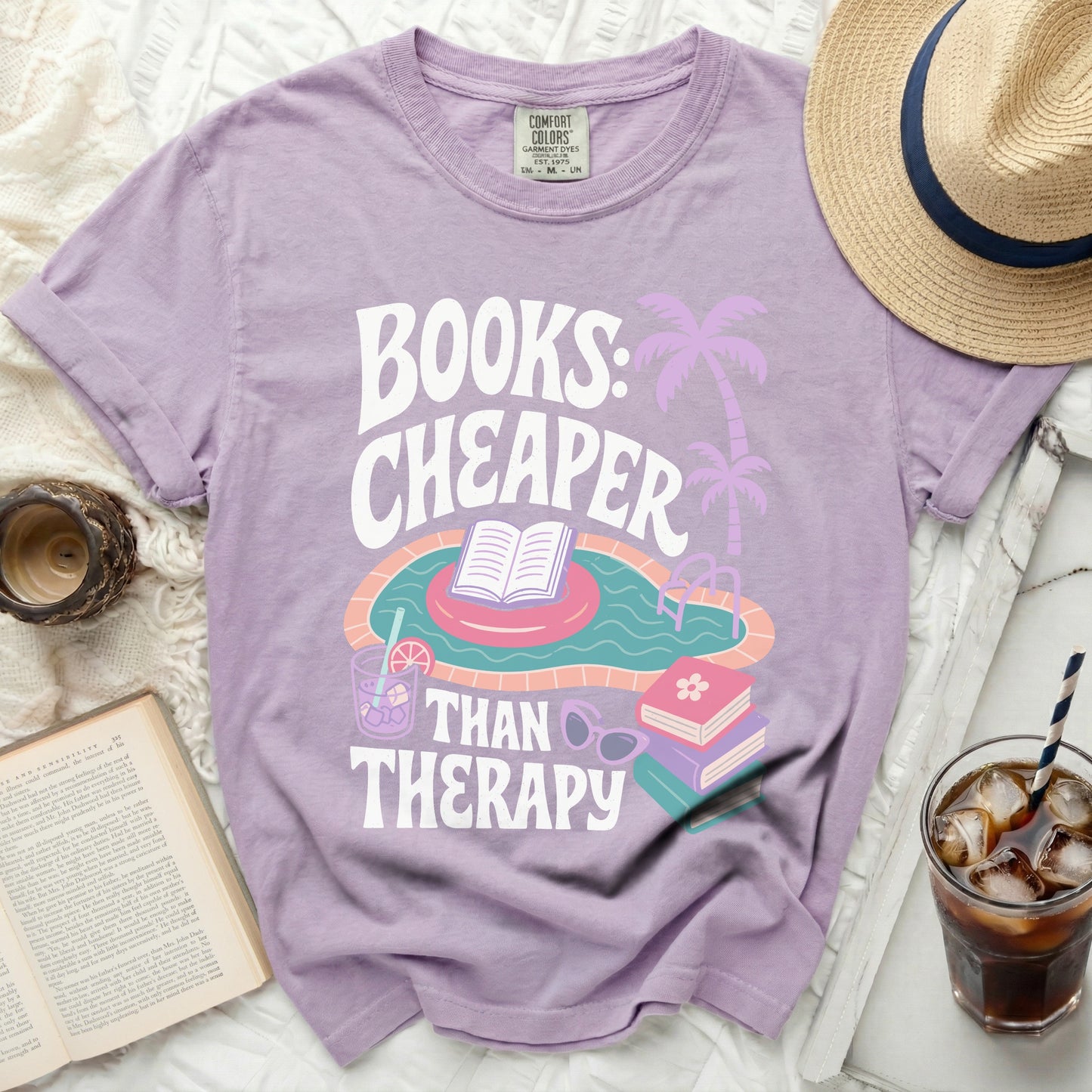 T-shirt with "Books: Cheaper Than Therapy" text and pool graphic.