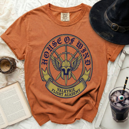 Orange t-shirt with "House of Wind Valkyrie Flight Academy" crest design.