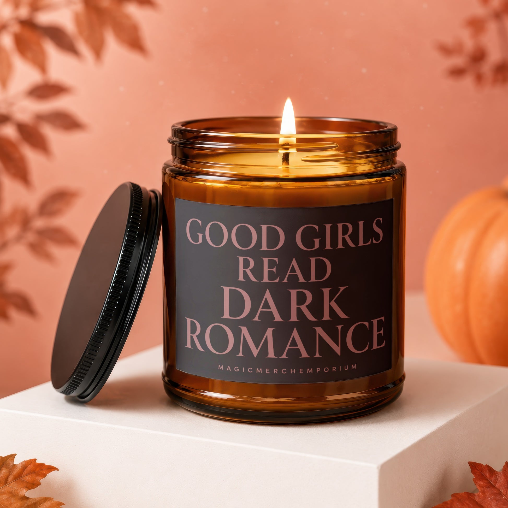 Amber candle with black label reading "Good Girls Read Dark Romance".