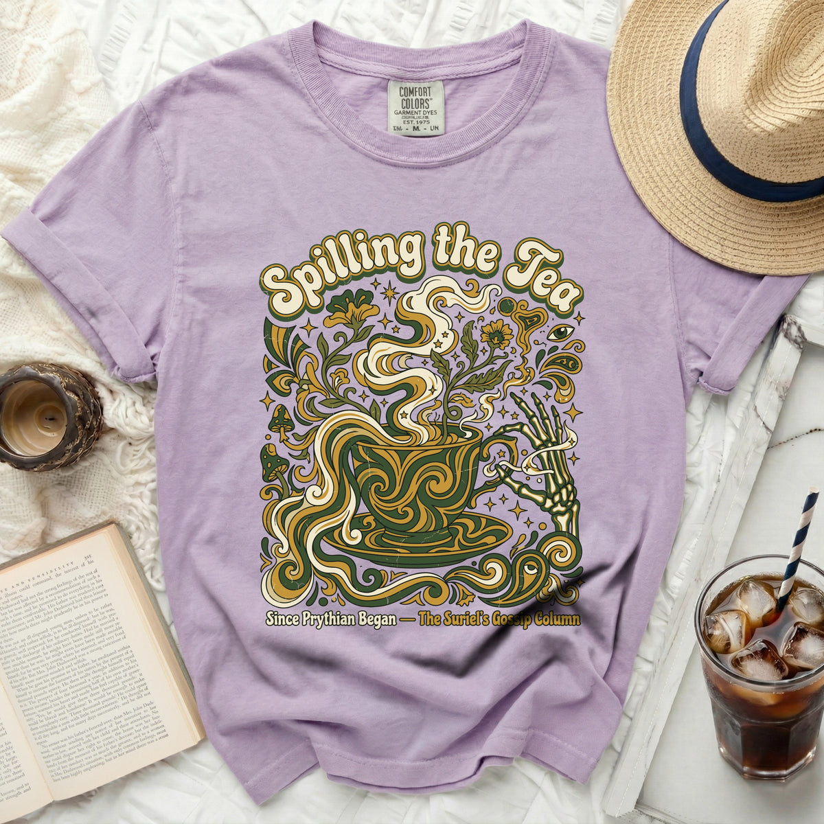 Purple t-shirt with "Spilling the Tea" and psychedelic floral design.