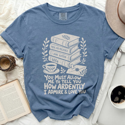 Blue t-shirt with books, teacup, letter, and Jane Austen quote.
