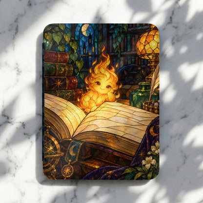 Cute fire creature rests on an open book in a stained-glass library.