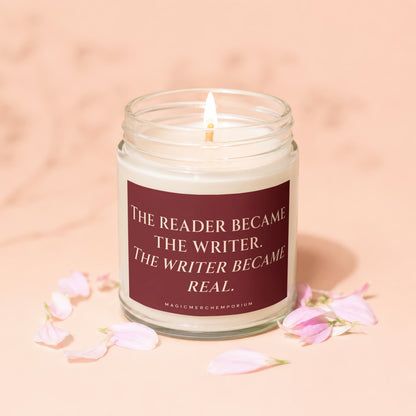 Glass jar candle with lit wick and quote about reading and writing.
