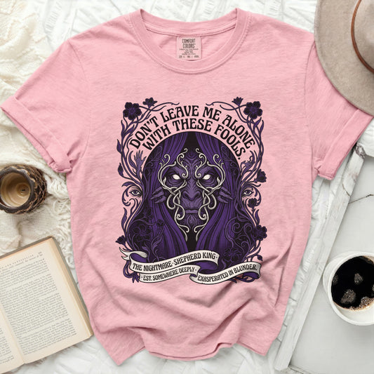 Pink t-shirt with "Don't Leave Me Alone With These Fools" graphic.