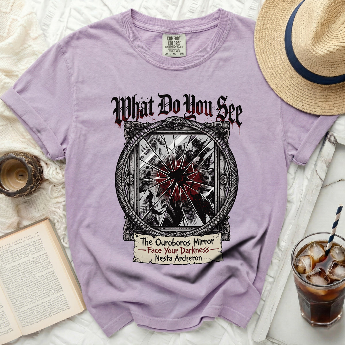 Purple t-shirt with "The Ouroboros Mirror - Face Your Darkness - Nesta Archeron" graphic.