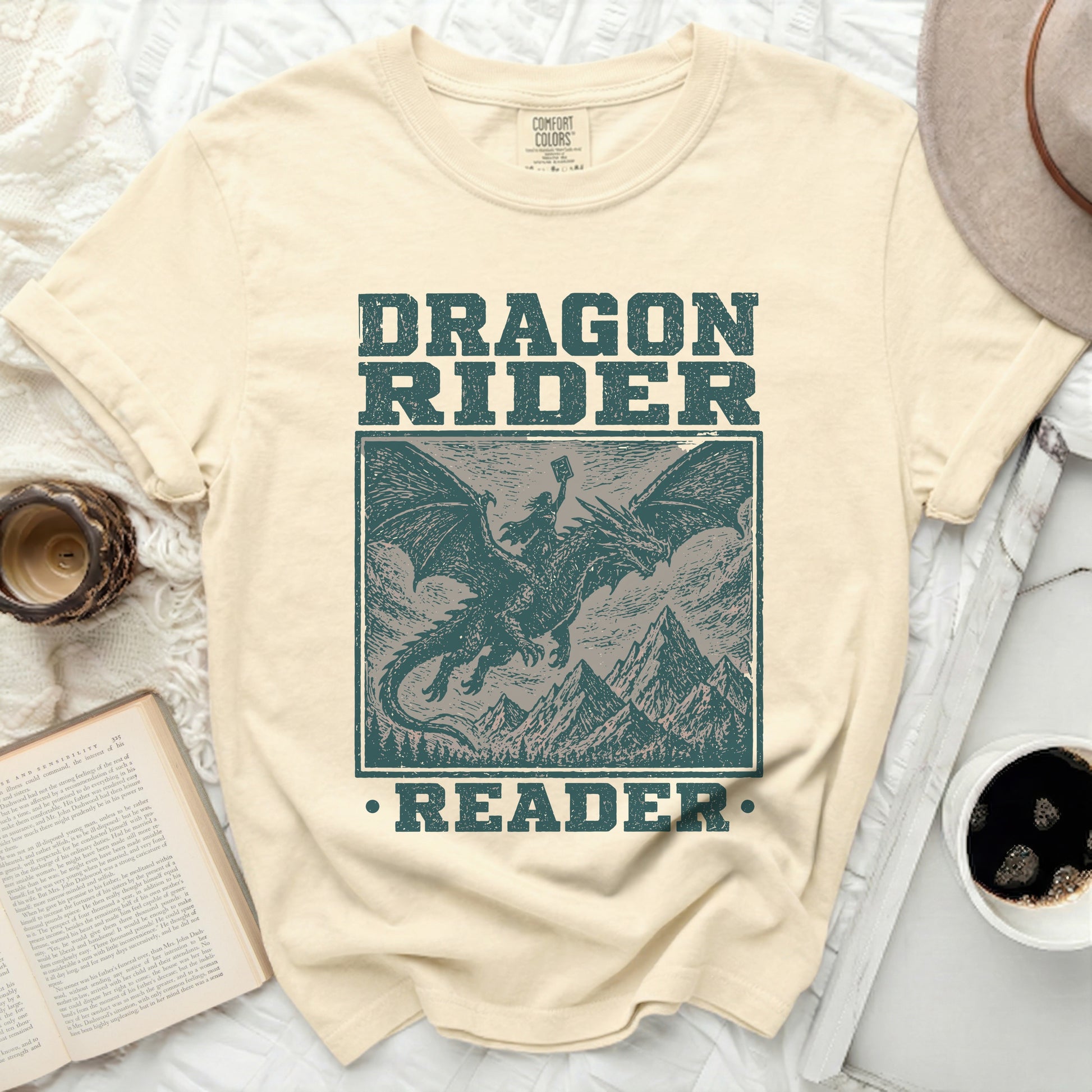 Cream t-shirt with distressed "Dragon Rider Reader" graphic.