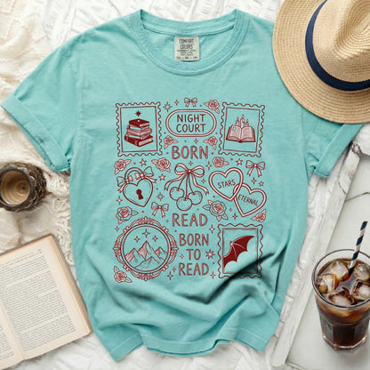 Teal t-shirt with "Night Court Born to Read" design and bookish stamps.