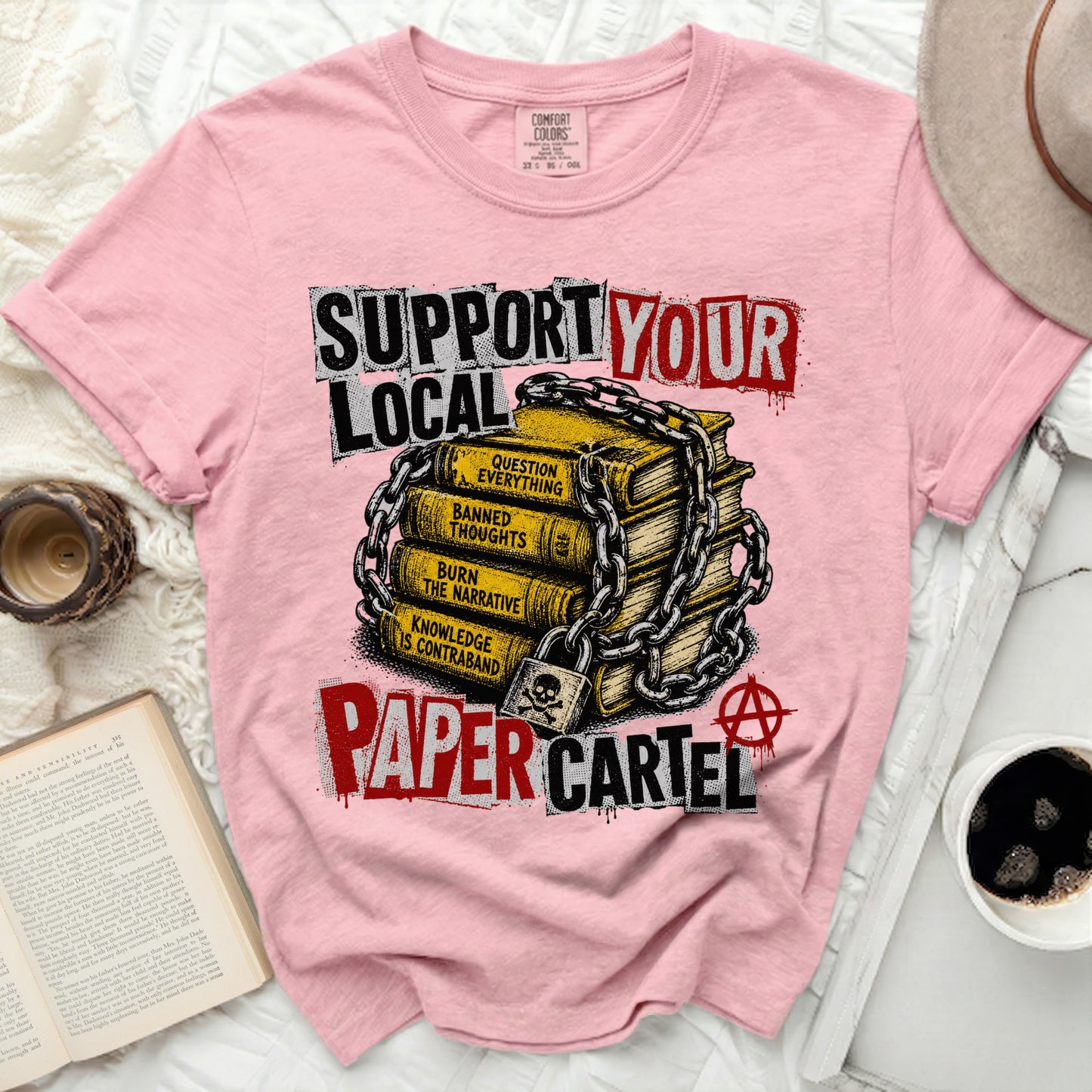 Pink t-shirt with "Support Your Paper Cartel" and chained books.