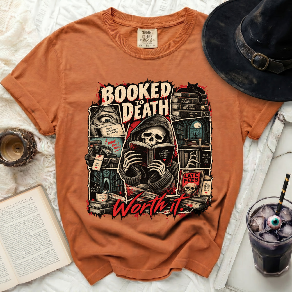 Orange t-shirt with "Booked to Death" graphic of a skeleton reading a book.