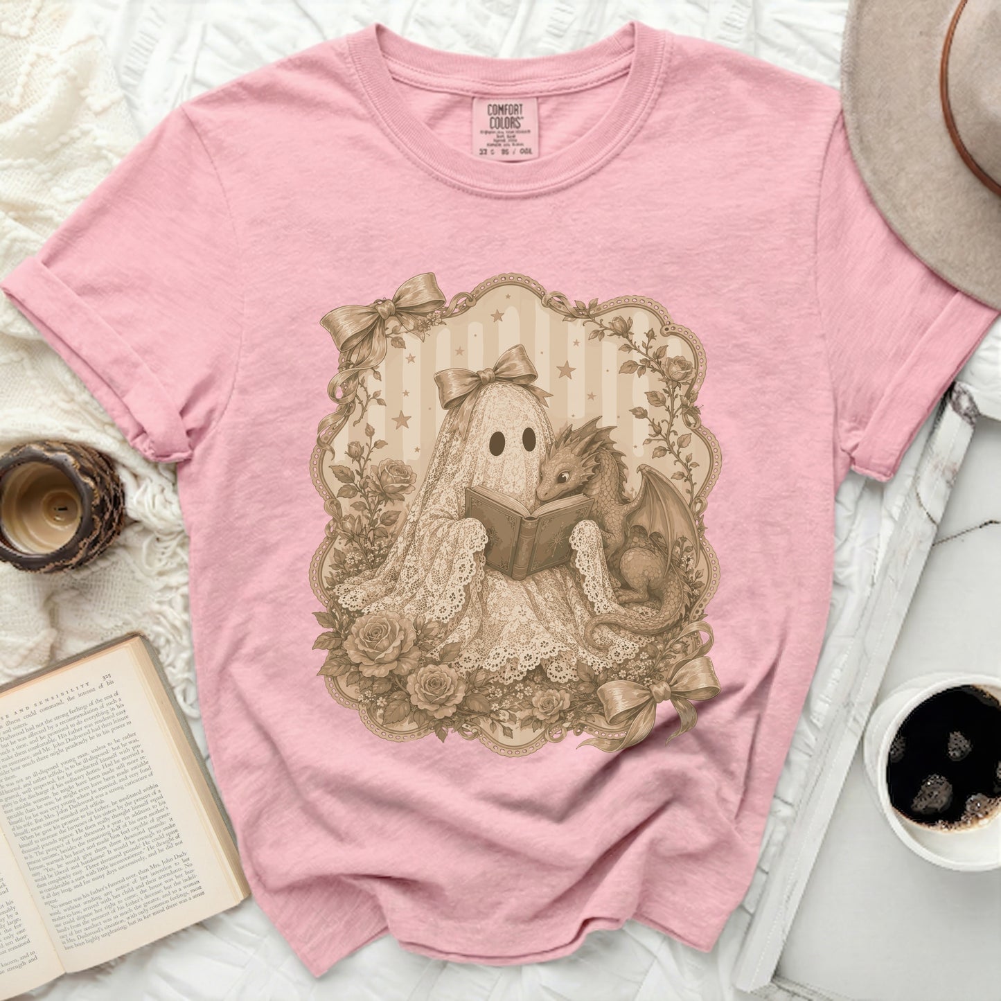 Pink t-shirt with a lace ghost reading to a dragon art print.