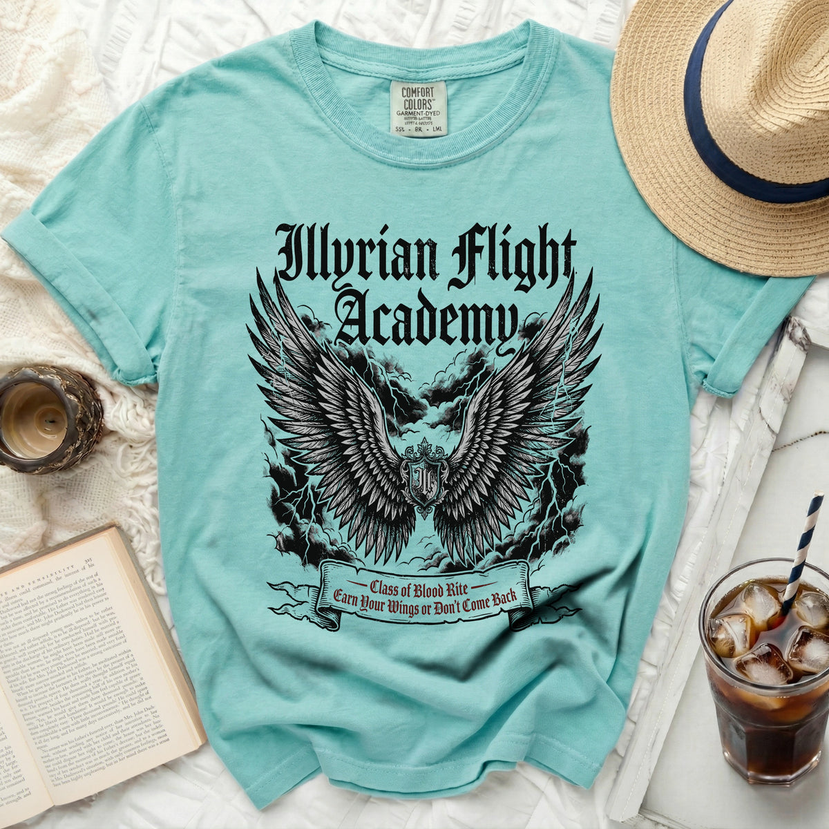 Teal t-shirt with "Illyrian Flight Academy" and winged crest graphic.