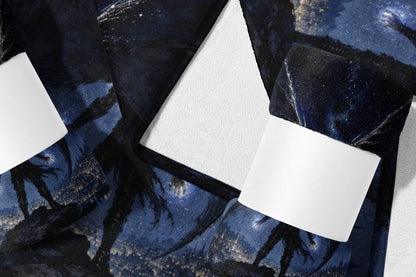 Blanket with a dark blue celestial design featuring a figure.