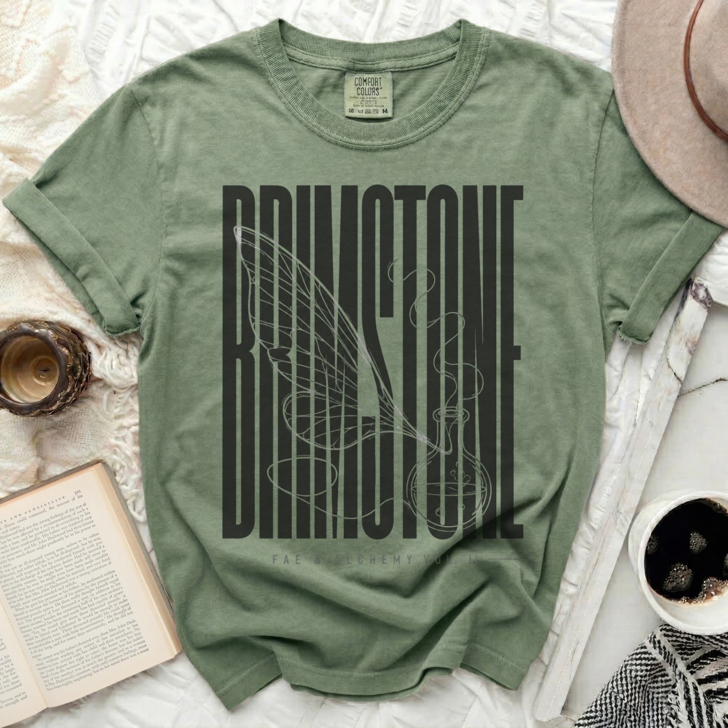 Green t-shirt with "BRIMSTONE" and a winged potion bottle design.