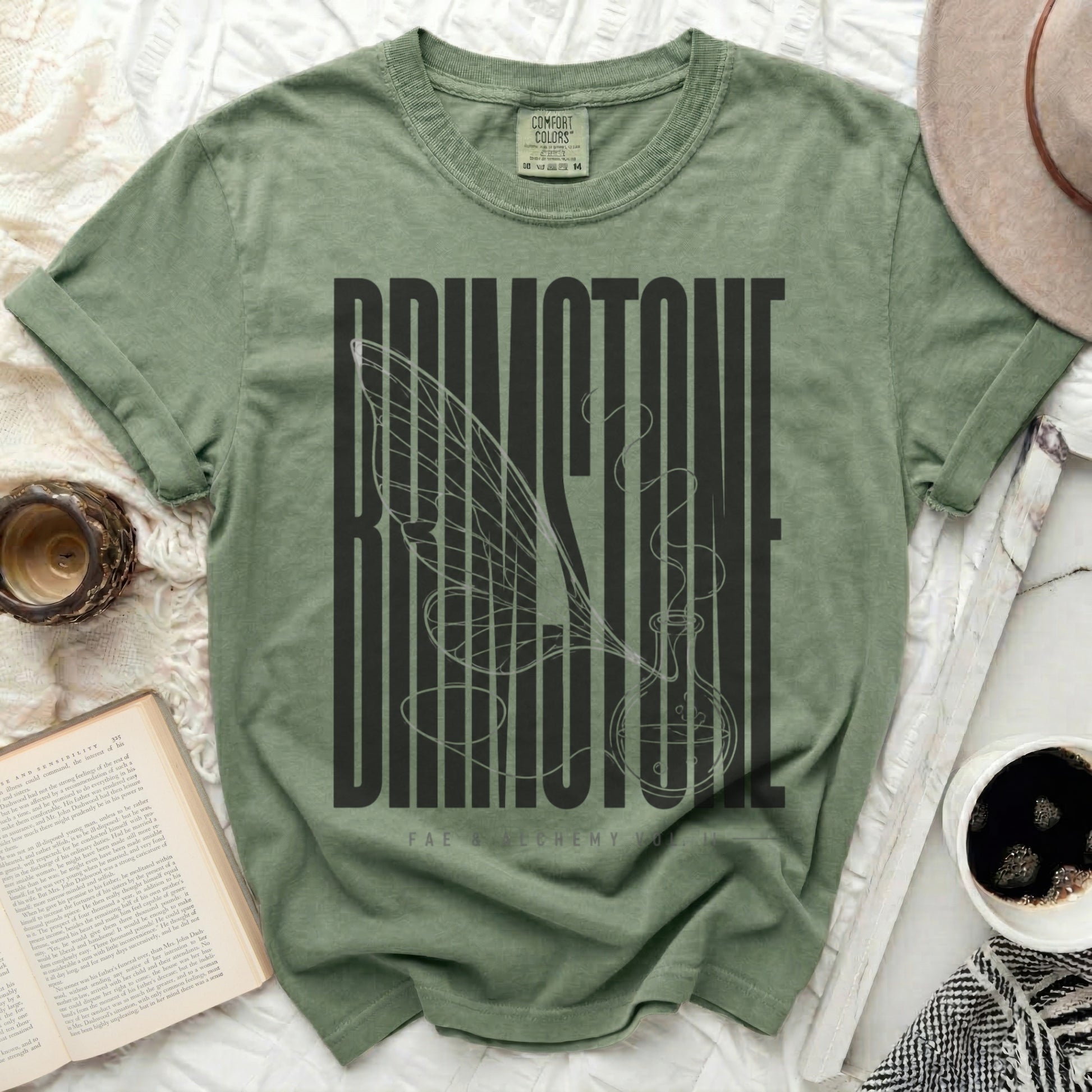 Green t-shirt with "BRIMSTONE" and a winged potion bottle design.