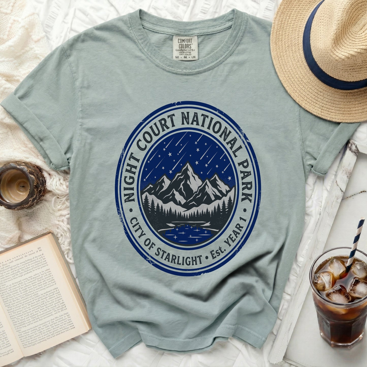 T-shirt with "Night Court National Park City of Starlight Est. Year 1" graphic.