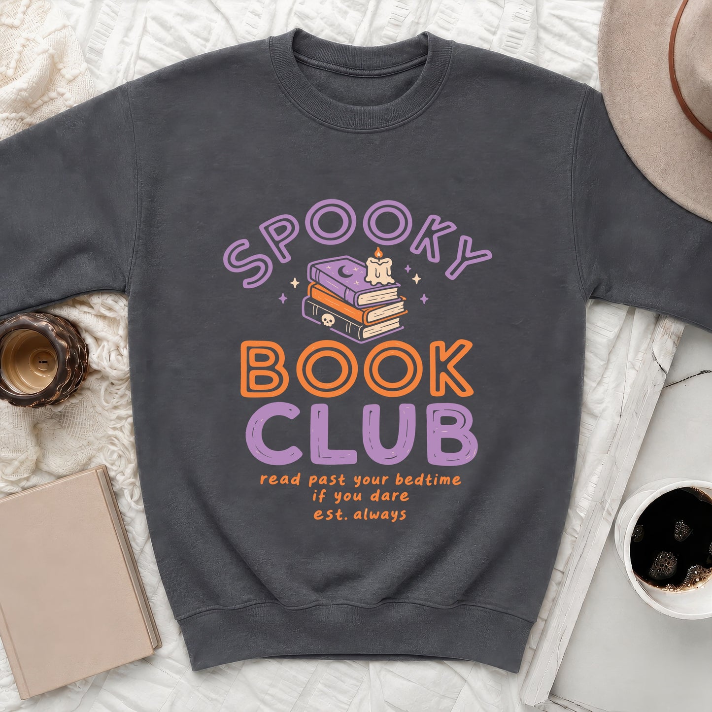 Dark gray sweatshirt with "Spooky Book Club" text and stacked books graphic.