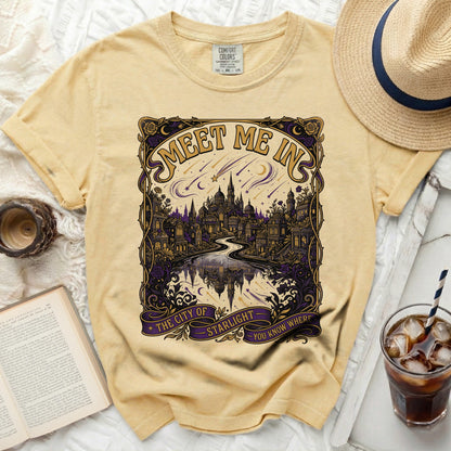 Light yellow Comfort Colors t-shirt with "Meet Me In The City of Starlight" graphic.