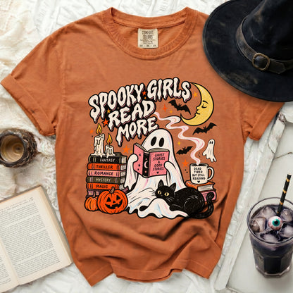 Orange t-shirt with "Spooky Girls Read More" graphic featuring a ghost, black cat, and books.