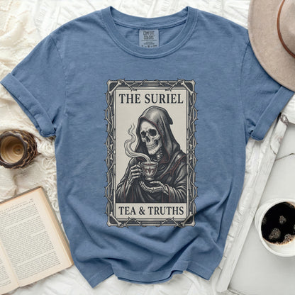 Blue t-shirt with graphic of Grim Reaper holding tea cup, text "THE SURIEL TEA & TRUTHS".