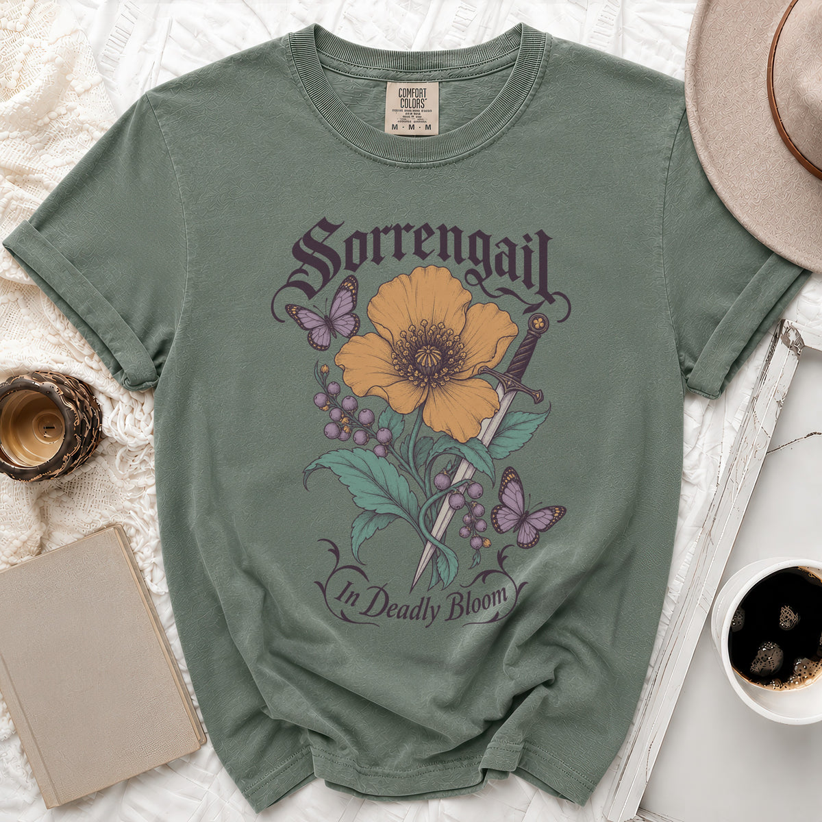 Green t-shirt with "Sorrengail In Deadly Bloom" text, sword, flower, and butterflies design.